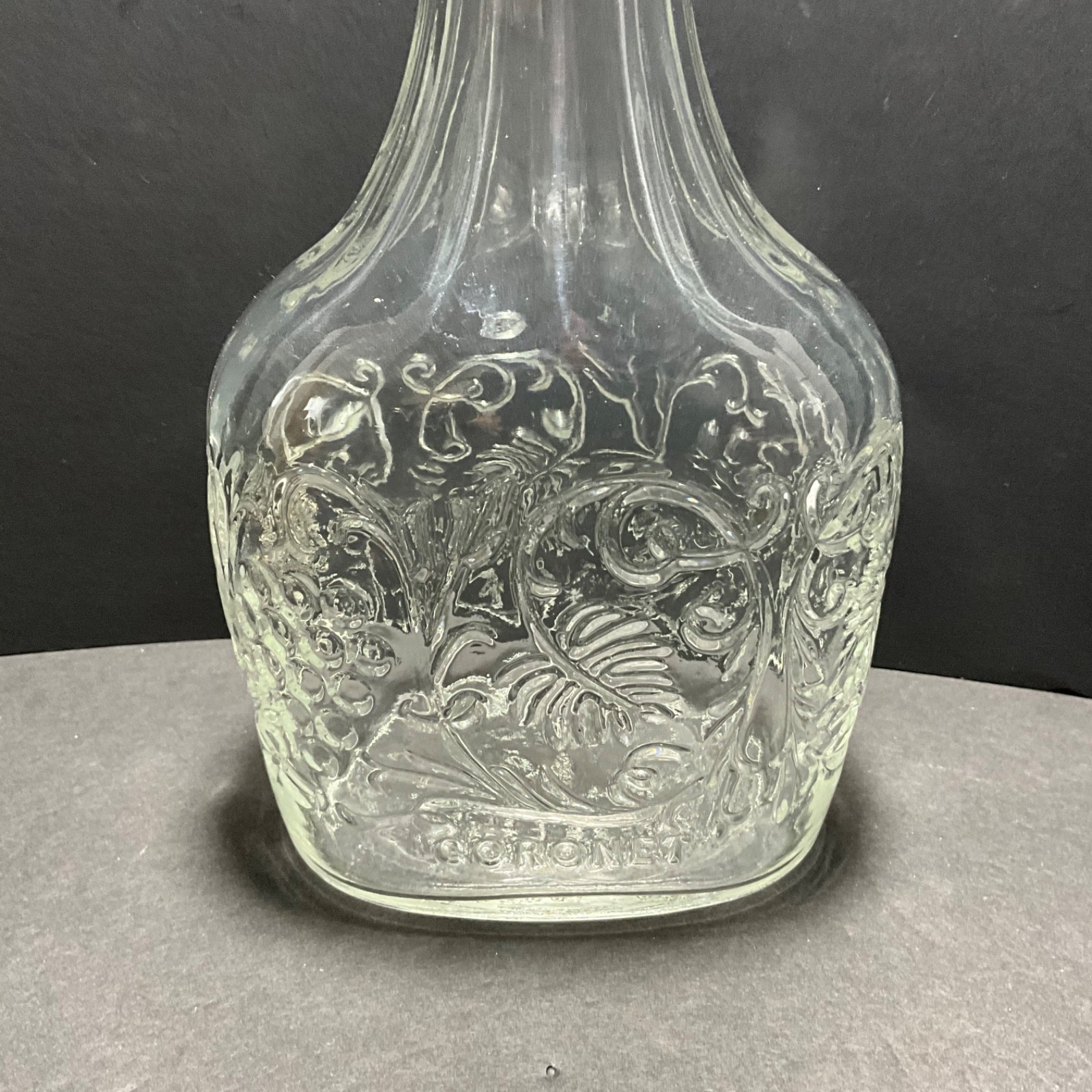 VINTAGE CORONET EMBOSSED BOTTLE GRAPE VINE MOTIF W/CORK 9”H RARE