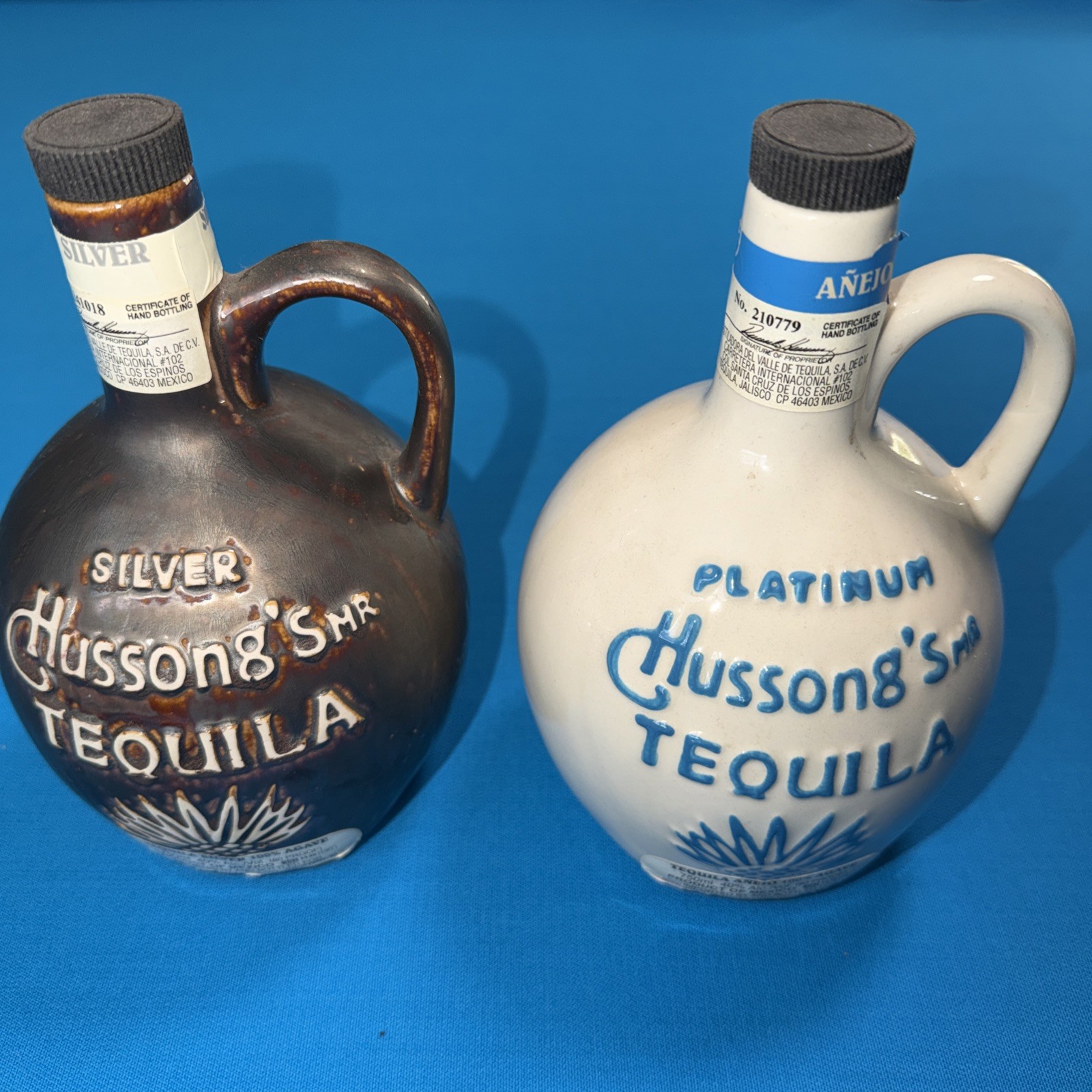 Hussong’s Platinum And Silver Tequila Ceramic Empty Bottle Lot of 2 750ml