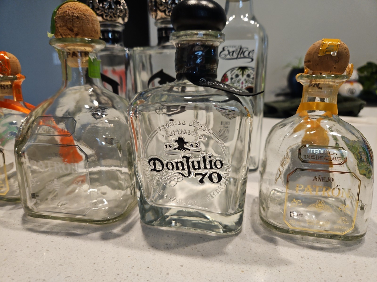 7 Tequila Bottle Lot: Deleon, Exotico, Don Julio, Patron W Toppers