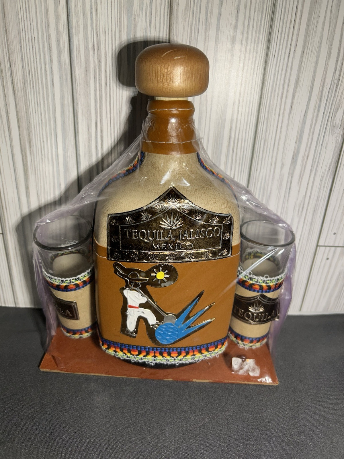 Tequila bottle empty with 2 double shot glasses