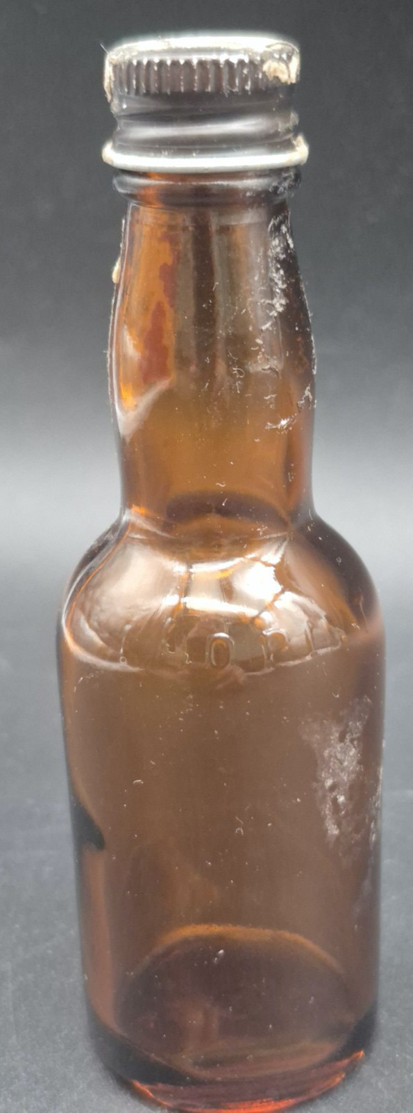 Antique Bright Amber Sample Size Whiskey Bottle. 4 1/4 Inches Tall.