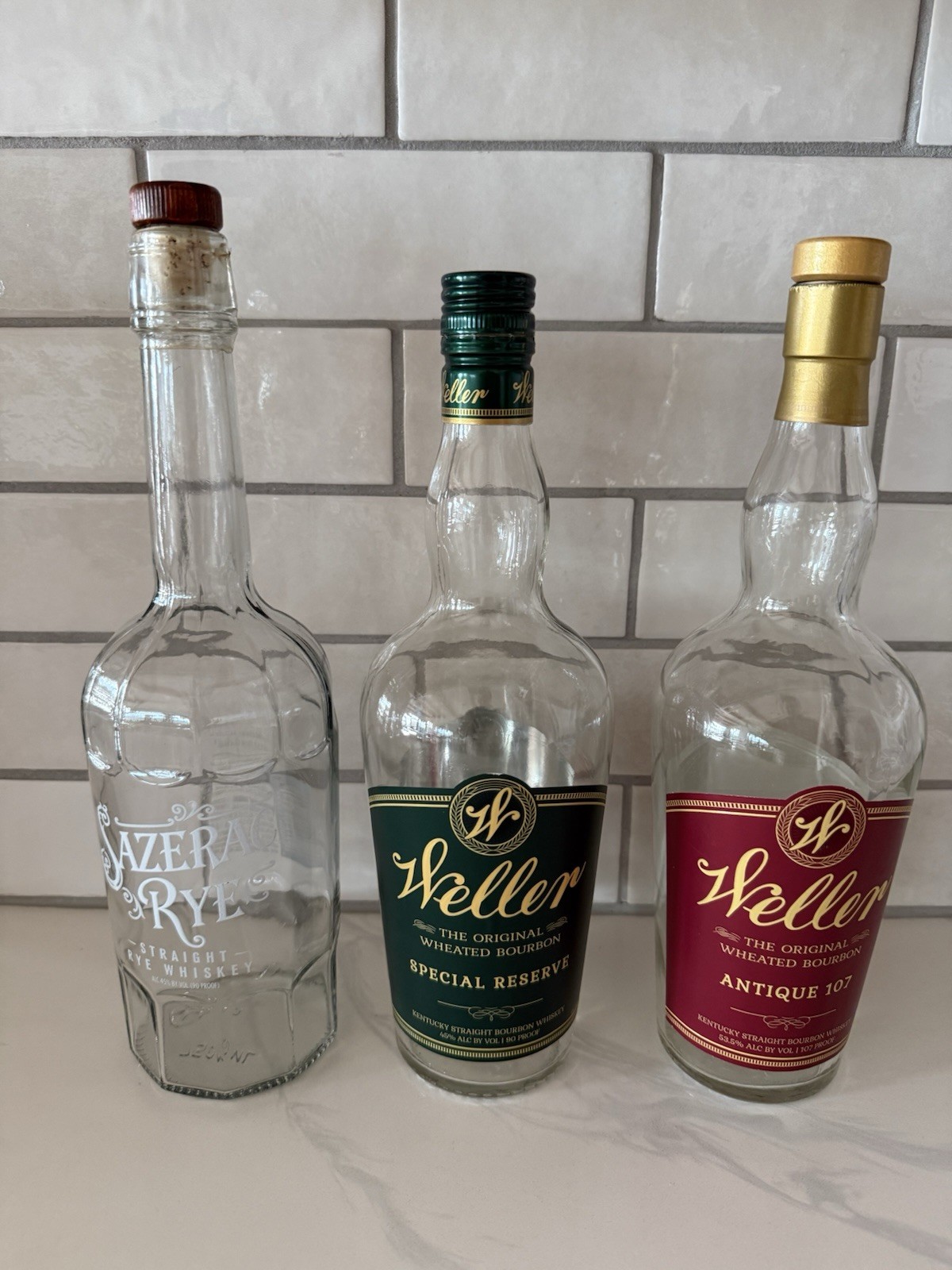 Lot of 3 Weller Bourbon Empty Bottles, Antique 107 Special Reserve, Sazerac Rye
