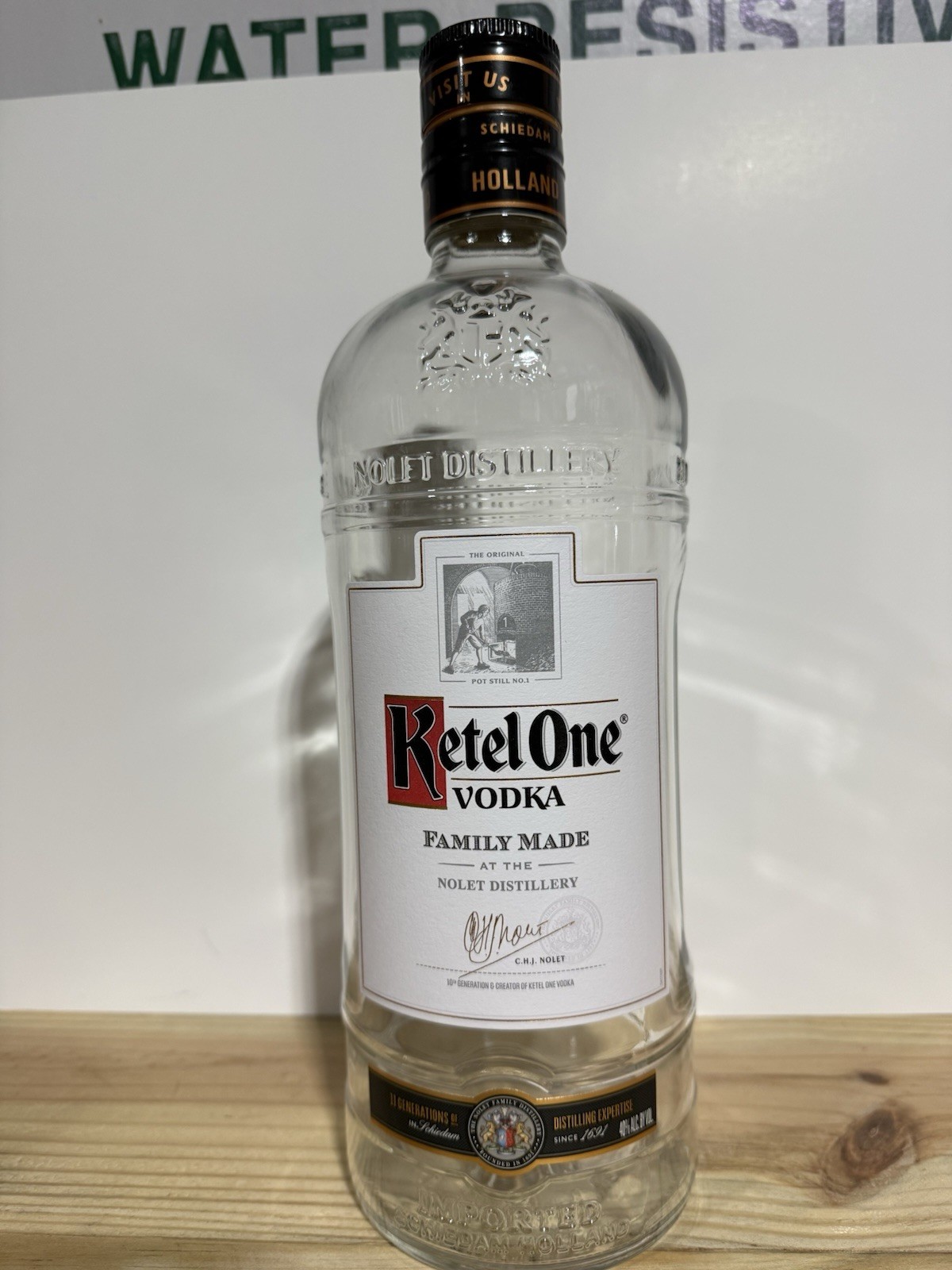 Empty 1.75 Liter Kettle One Vodka Bottle with Cap and Round Embossed Design