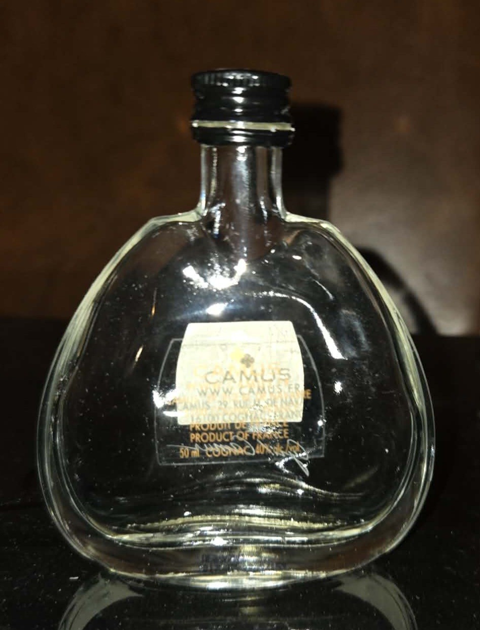Empty miniature bottle of Camus XO Elegance Cognac,